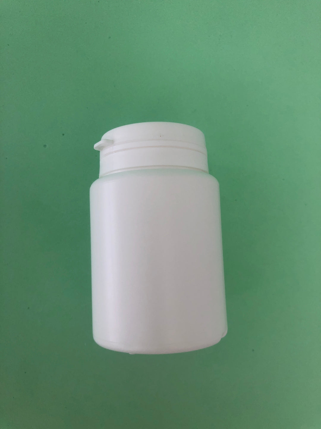 white capsule bottle
